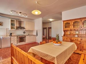 A kitchen or kitchenette at Holiday Home Simoni - GLA107 by Interhome