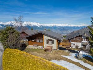 a house with a view of the mountains at Chalet L'Alouette by Interhome in Nendaz