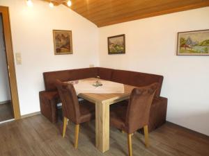 a dining room table and chairs in a room at Apartment Hof am Schönbach - STA161 by Interhome in Sankt Jakob