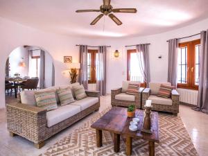 a living room with couches and a table at Holiday Home Lucia by Interhome in Monte Pego