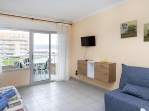A television and/or entertainment centre at Apartment Residencial Manureva II by Interhome
