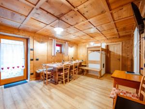 a large dining room with a table and chairs at Holiday Home Mantel by Interhome in Mazzin
