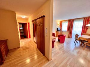 a living room with a table and a dining room at Apartment Hofresidenz-3 by Interhome in Altenmarkt im Pongau