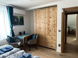 a bedroom with a desk and a bed and a table at Haus an der Sieber Zimmer 4 in Herzberg am Harz