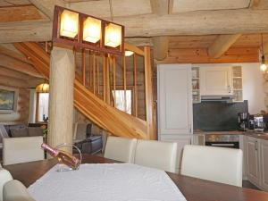 a kitchen and dining room with a table and chairs at Chalet Chalet Karin by Interhome in Innsbruck