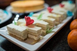 a plate with several pieces of cake on a table at Sotavento Beach Club in Costa Calma