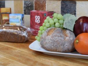 a plate of fruits and vegetables on a table at Holiday Home Pa by Interhome in Machynlleth