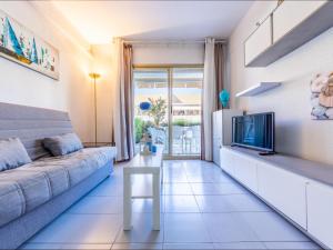 A seating area at Apartment Golf Sant Jordi by Interhome