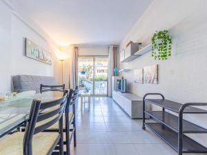 A seating area at Apartment Golf Sant Jordi by Interhome