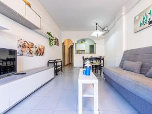 A seating area at Apartment Golf Sant Jordi by Interhome