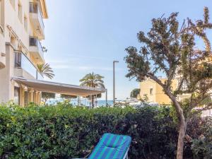 A garden outside Apartment Golf Sant Jordi by Interhome