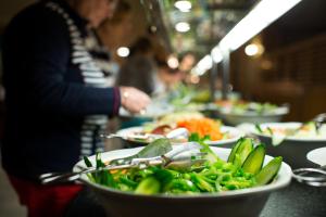 a buffet line of plates of food on a table at Sotavento Beach Club in Costa Calma