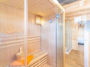 a sauna with a shower and a glass door at Holiday Home Chalet Toni mit Sauna by Interhome in Spiegelau