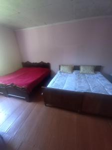 Postel nebo postele na pokoji v ubytování Maia's Guesthouse