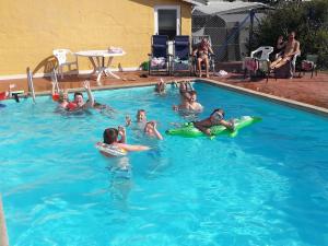 a group of people swimming in a swimming pool at Nissum Fjord Camping in Fjand Gårde +34 photos