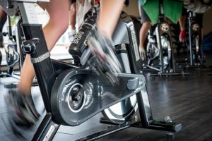 a group of people on bikes in a gym at Sotavento Beach Club in Costa Calma