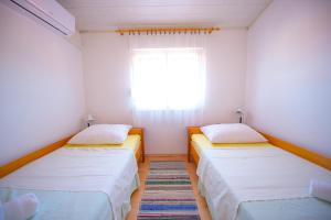 Postel nebo postele na pokoji v ubytování Garden Resort - Apartments Ruzmarin