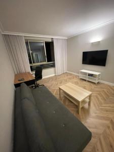 a living room with a couch and a table at Apartment on Haifa in Haifa