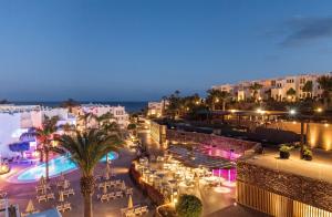 a view of a resort at night with a pool at Sotavento Beach Club in Costa Calma