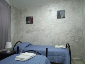Posteľ alebo postele v izbe v ubytovaní Case Serena vacanze relax