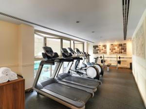 a gym with cardio equipment in a hotel room at Leonardo Boutique Hotel Larnaca in Larnaca