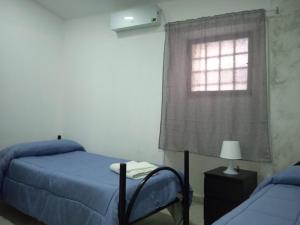 Posteľ alebo postele v izbe v ubytovaní Case Serena vacanze relax