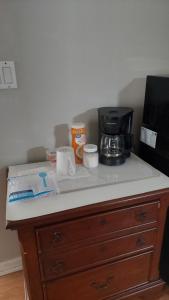 a counter top with a coffee maker on top of it at Close to beach in Fort Pierce