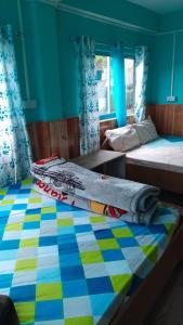 Postel nebo postele na pokoji v ubytování Parichay Homestay