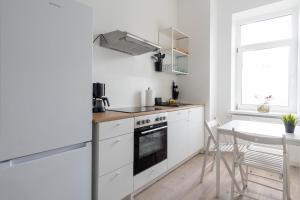 Kuchyň nebo kuchyňský kout v ubytování Komfortable Monteursunterkunft: 4-Zimmer-Wohnung mit getrennten Betten
