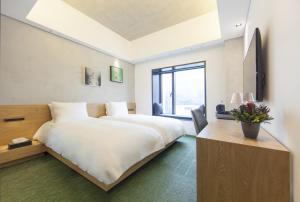 Postel nebo postele na pokoji v ubytování StayB Hotel Myeongdong