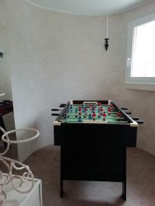 a large pool table in a room at Gîte Mémoire de cœur 14 pers in Foucherans