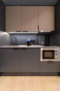 A kitchen or kitchenette at Zalo Urban Living Spaces