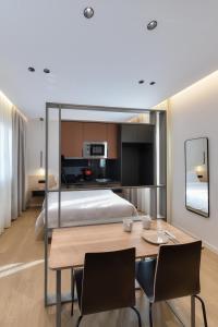A bed or beds in a room at Zalo Urban Living Spaces