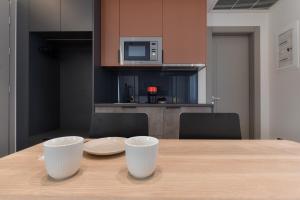 A kitchen or kitchenette at Zalo Urban Living Spaces