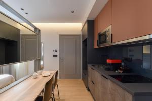A kitchen or kitchenette at Zalo Urban Living Spaces