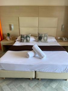 Krevet ili kreveti u jedinici u okviru objekta Taormina Hotel Calipso