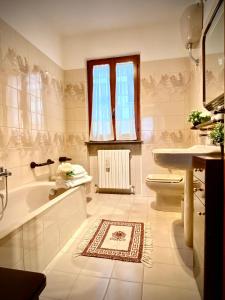 a bathroom with a tub and a toilet and a sink at Casa Micca - Cielo Terra in San Benedetto del Tronto +72 photos