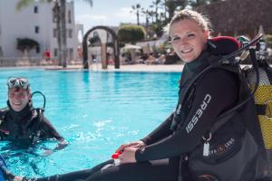 two women in the water in a swimming pool at Sotavento Beach Club in Costa Calma
