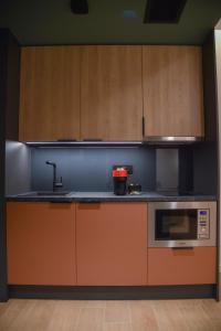 A kitchen or kitchenette at Zalo Urban Living Spaces