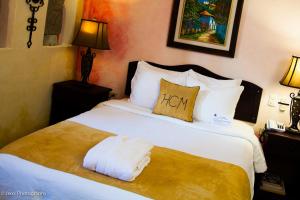 Cama o camas de una habitación en Hotel Camino Maya