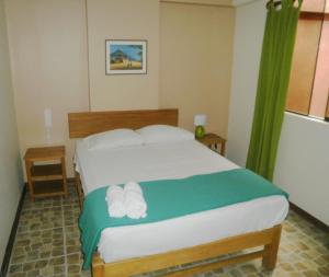 Postel nebo postele na pokoji v ubytování Hospedaje La Videna