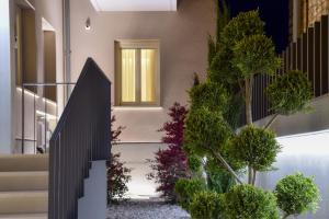 a house with a black gate in front of a house at Zalo Urban Living Spaces in Ioannina