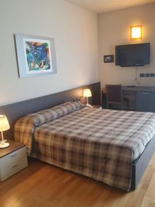 Postel nebo postele na pokoji v ubytování eq hotel