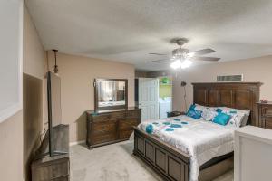 a bedroom with a bed and a ceiling fan at Cozy Georgia Vacation Rental with Backyard and BBQ in Waycross