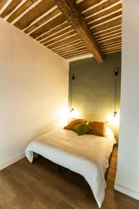 Posteľ alebo postele v izbe v ubytovaní Douceur au coeur du Panier