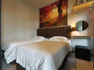 מיטה או מיטות בחדר ב-K'S11 JQ Homestay Jesselton Quay Citypads Kota Kinabalu