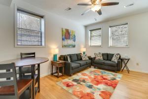uma sala de estar com um sofá e uma mesa em Marlinton Vacation Rental on Riverfront Trail! em Marlinton