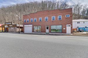 a brick building on the side of a street at Downtown Marlinton Vacation Rental Apartment! in Marlinton