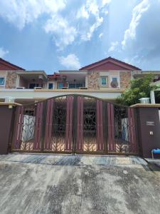 a gate in front of a house at Ipoh Premium Cozy Relax Home in Ipoh