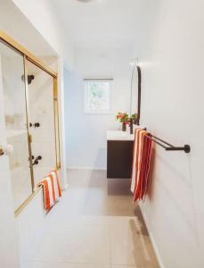 a bathroom with a shower and a sink at Very Cool Mid Century, Pet Friendly Urban Oasis in Geelong